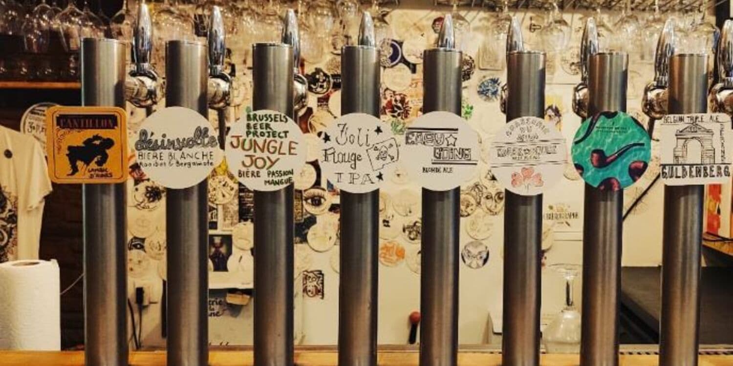 Close-up of the beer tap wall with hand-drawn tap badges