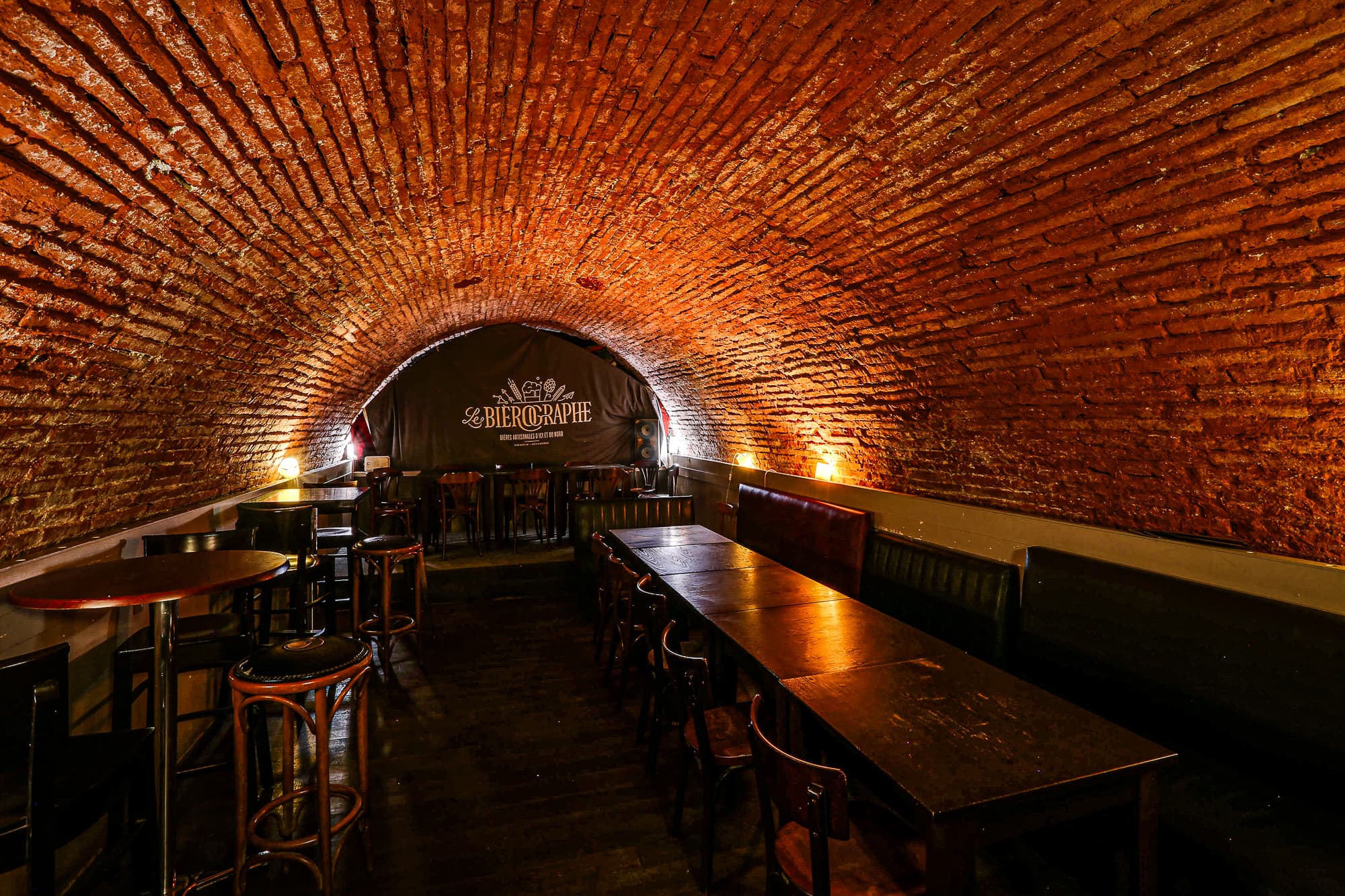 The vaulted cellar with communal tables, another angle
