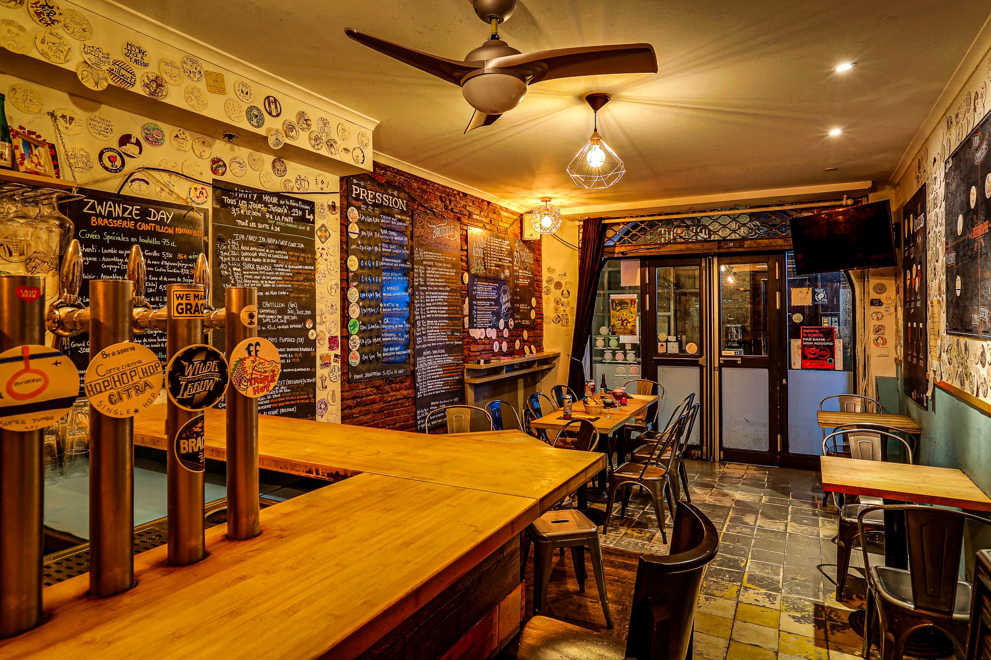 The upstairs bar with the Pression and Bouteille chalkboard menus